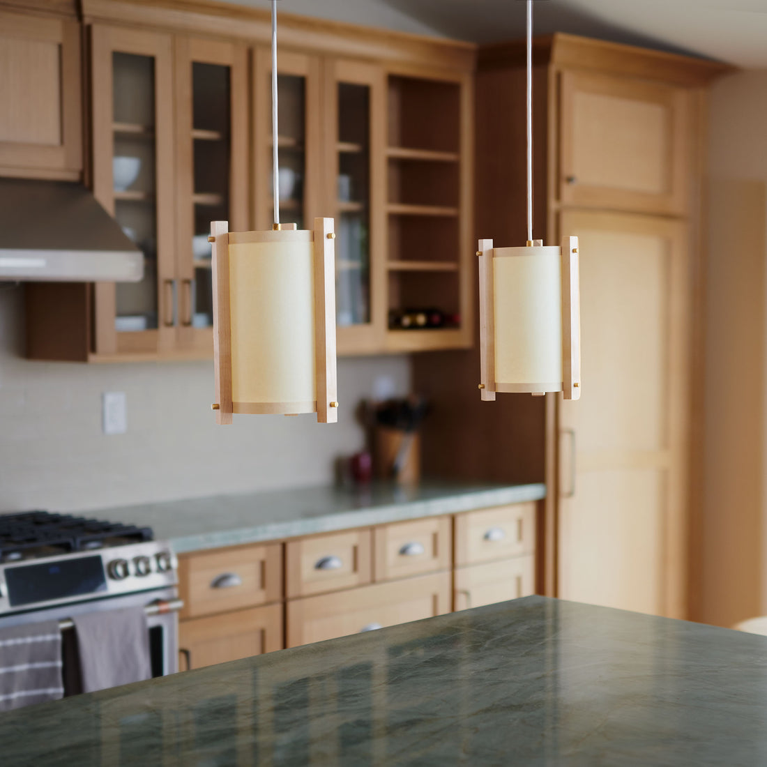 Maple and white pendants in kitchen