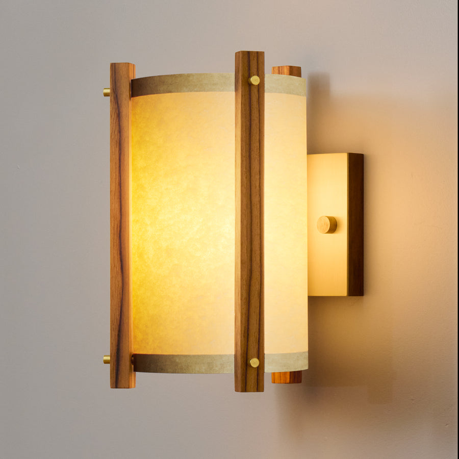 Teak Sconce Sand Lampshade Side View illuminated