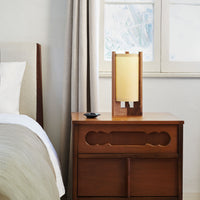 Walnut Table Lamp with Sand Lampshade on nightstand next to window and bed