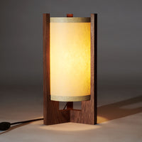 Japanese Mid Century Walnut Table Lamp illuminated with sand lampshade