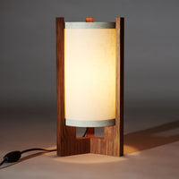 Japanese Mid Century Teak Table Lamp illuminated with white glow