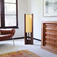 Walnut Floor Lamp in corner with rug chair window and dresser